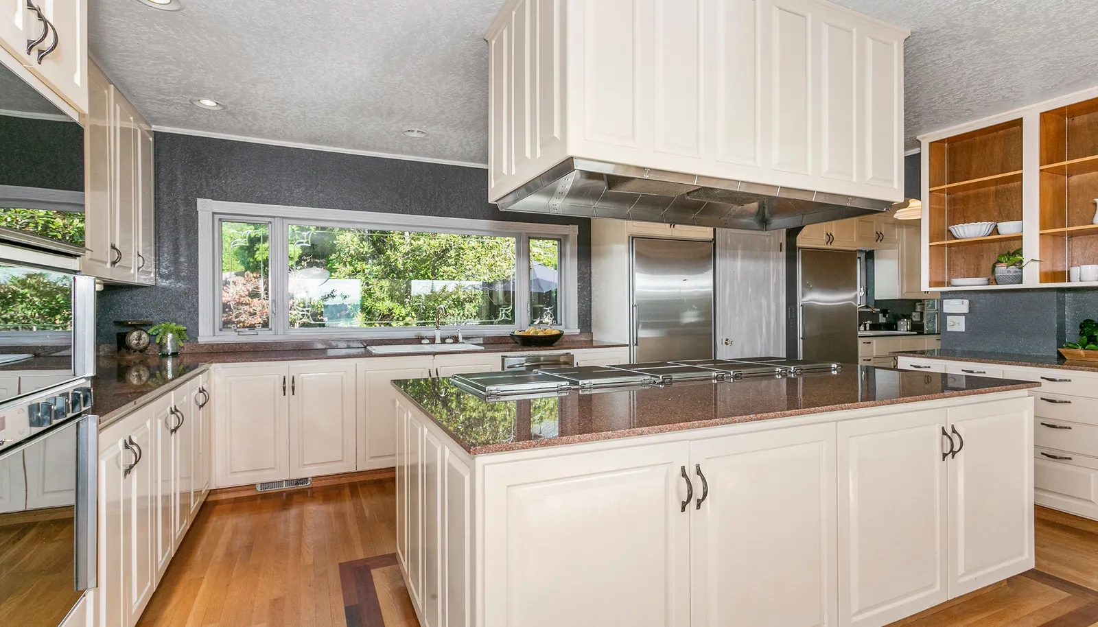Kitchen features 5 cooktop Gaggenau stove, Gaggenau double ovens, separate Sub Zero refrigerator and Sub Zero freezer, storage galore. Kitchen features 5 cooktop Gaggenau stove, Gaggenau double ovens, separate Sub Zero refrigerator and Sub Zero freezer, storage galore.