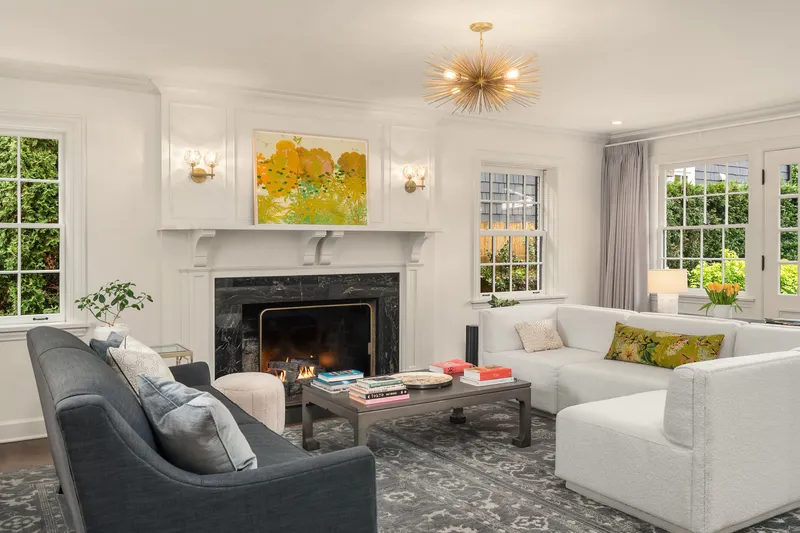 Windows on all sides flood this room with happy sunshine. There is a door on the back wall that leads out to the backyard & patio.