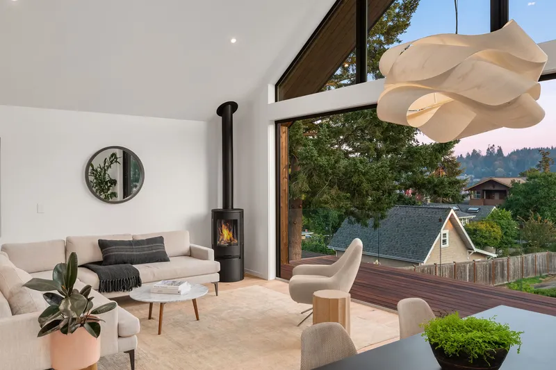 The entire 18' wall opens up to the Cumaro sustainable hardwood deck with invisible glass panel railing system!