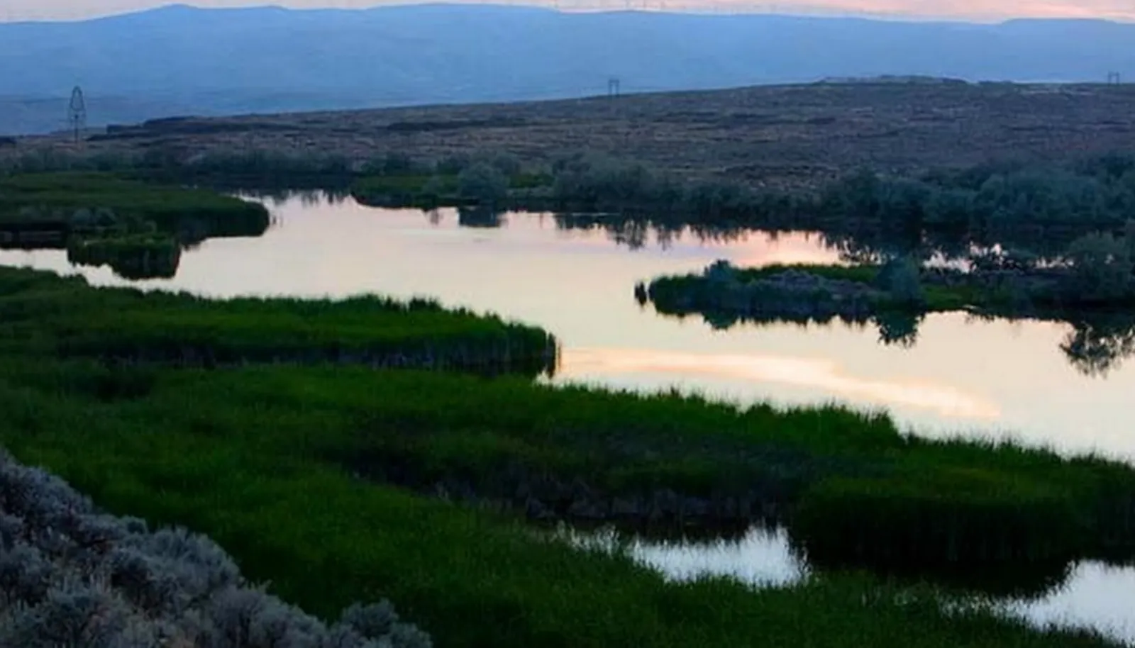 60 acres of lakes and ponds altogether: Hilltop Lake (30 acres) spills over the 400 ft. high basalt cliff into a water fall. Caliche Creek tumbles down alongside the Old Covered Wagon trail into the Coulee. 60 acres of lakes and ponds altogether: Hilltop Lake (30 acres) spills over the 400 ft. high basalt cliff into a water fall. Caliche Creek tumbles down alongside the Old Covered Wagon trail into the Coulee.