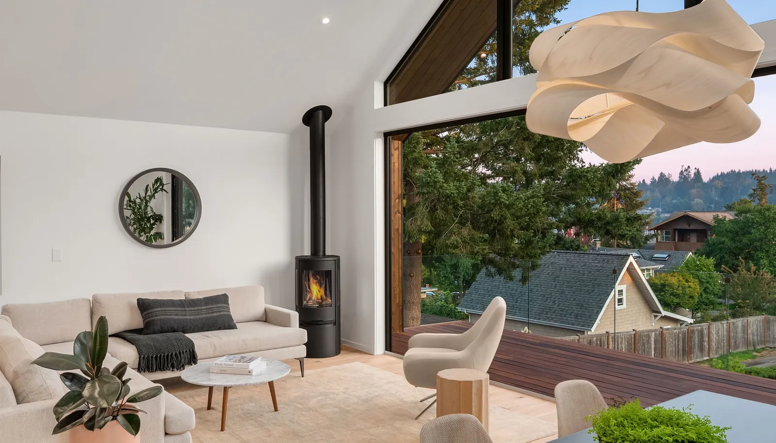 The entire 18' wall opens up to the Cumaro sustainable hardwood deck with invisible glass panel railing system!