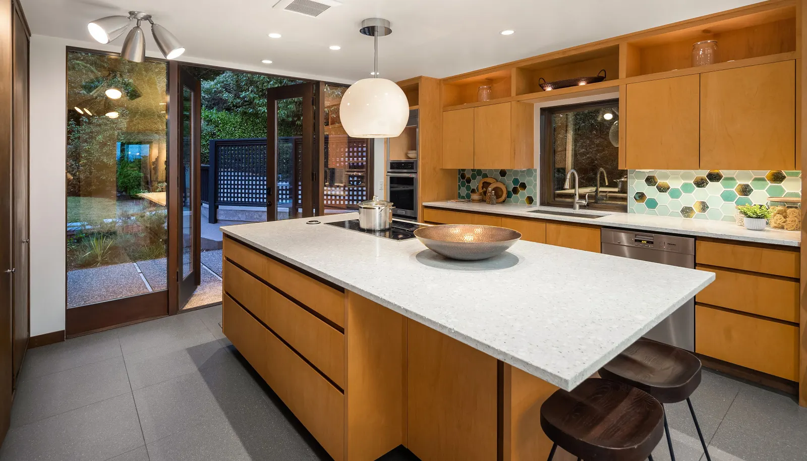 Open these French doors out to the private front patio for al fresco dining. These doors could also be a convenient second entry given the proximity to the driveway. For example, unloading groceries from the car would be a breeze!