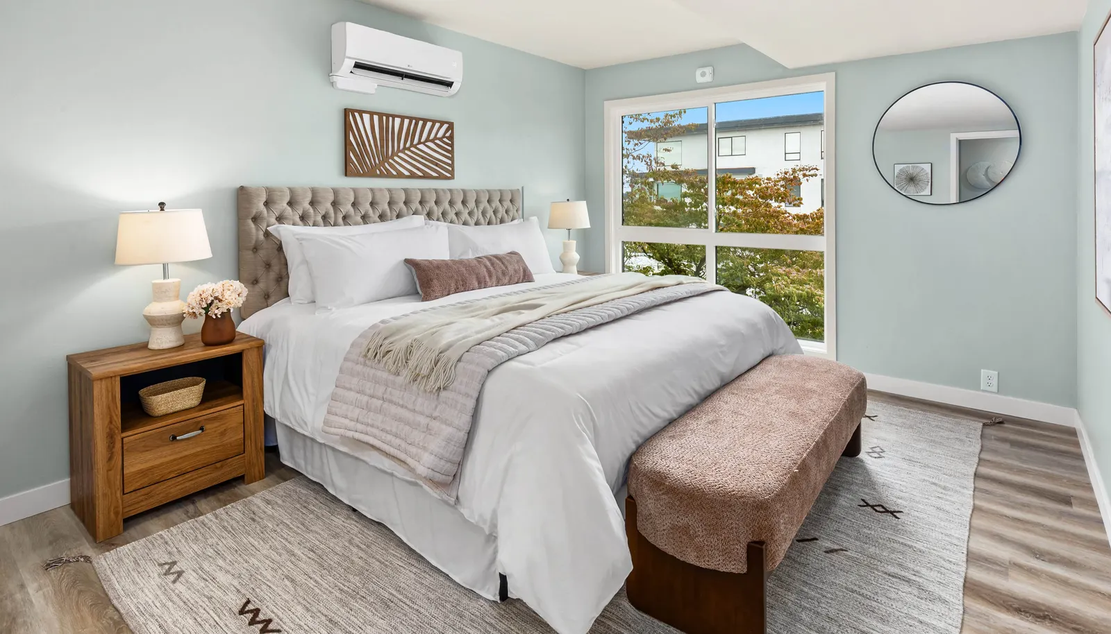 Spacious primary bedroom featuring scenic views and a private ensuite bathroom.