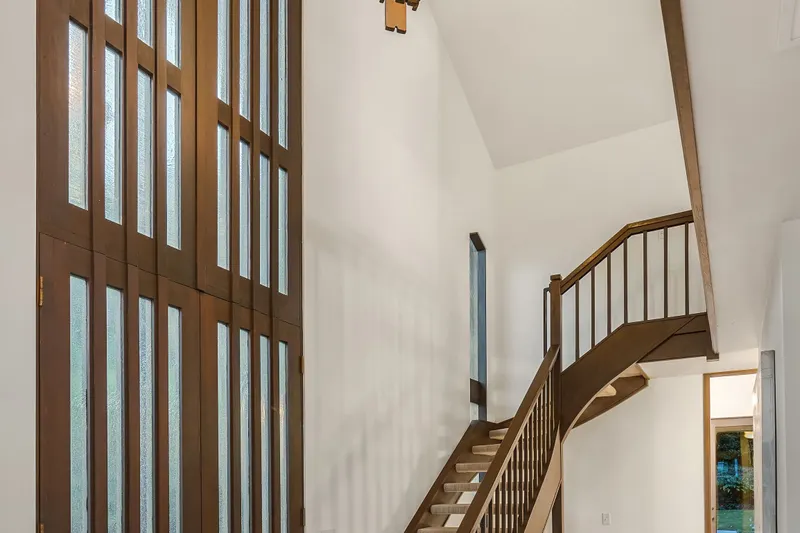 The cathedral ceilings throughout and the two-story entry hall provide a spacious feel and unique ambiance.