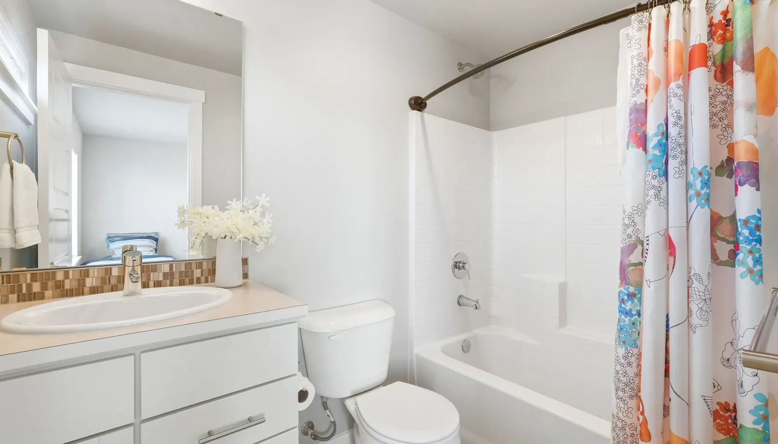 The well-appointed secondary bathroom provides comfort and privacy for guests or shared living.