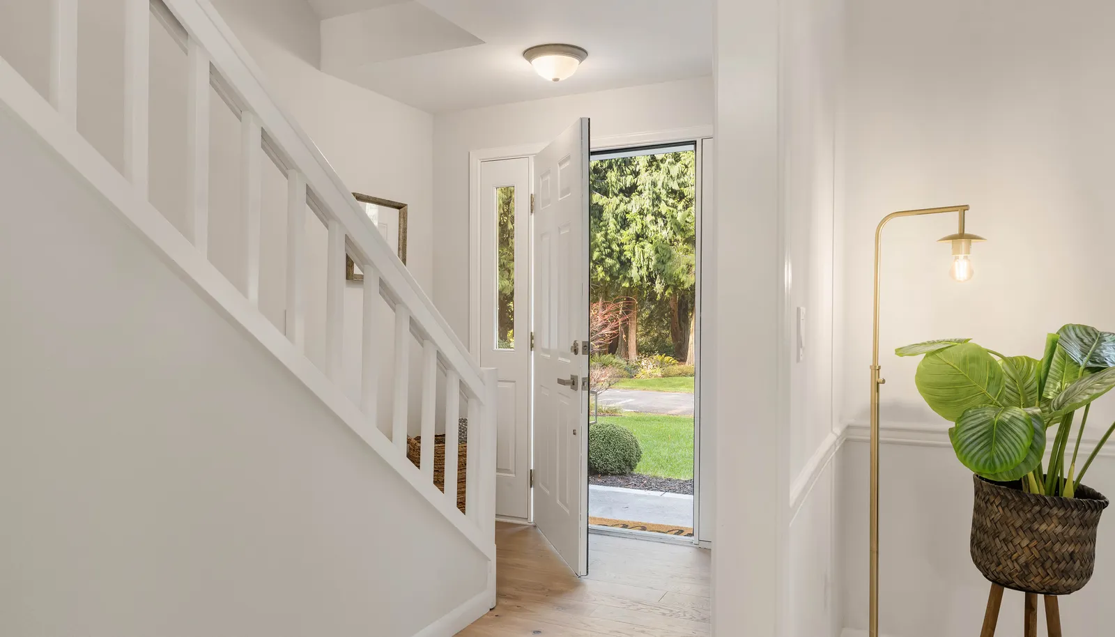 View from the living room to the front door. New designer paint throughout the entire home!