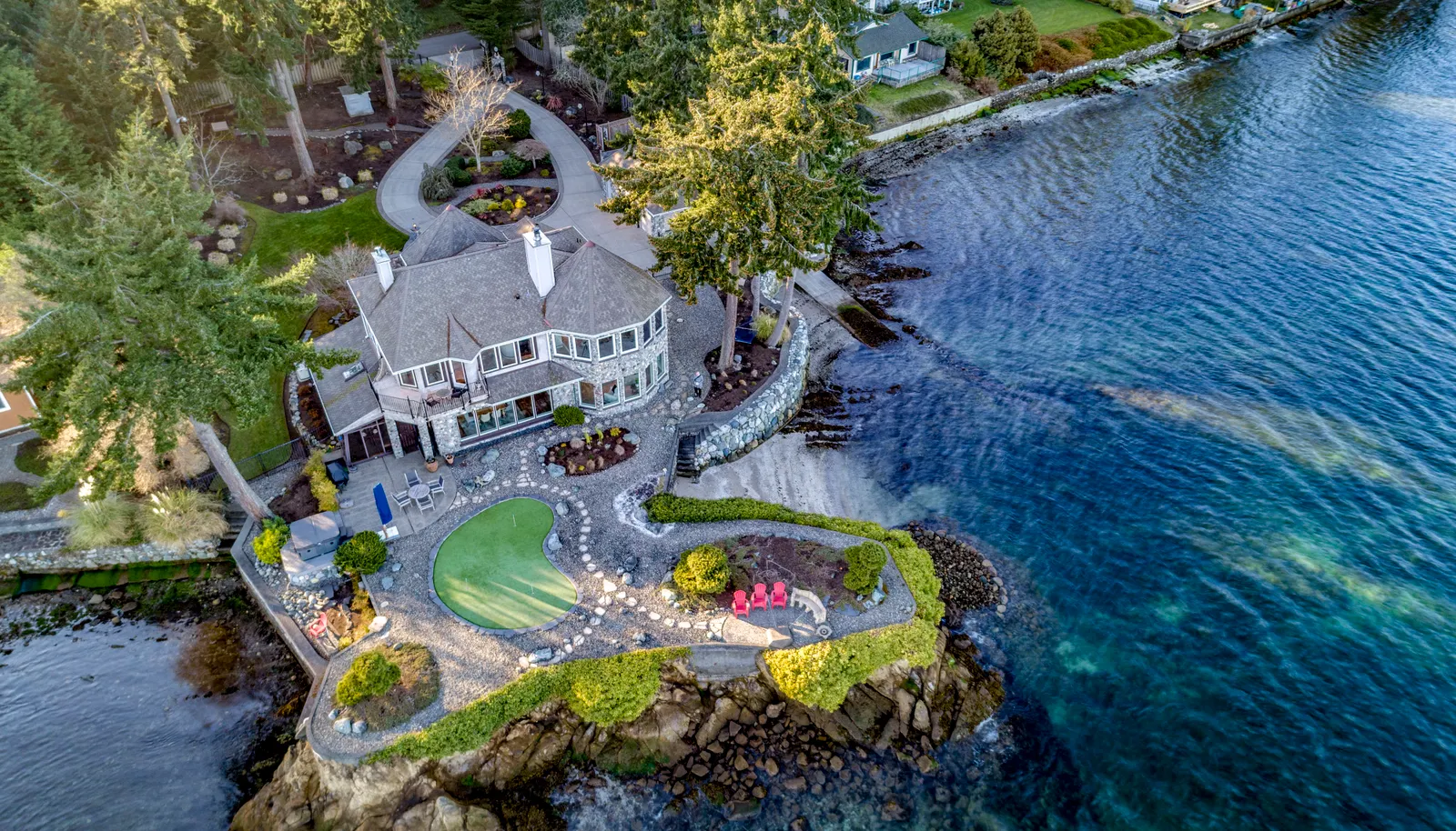 A private and quiet, gated, perfectly level shy acre lot with 215' of beachfront wrapping around its own peninsula!