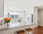The generous breakfast bar is ideal for both everyday dining and casual gatherings.