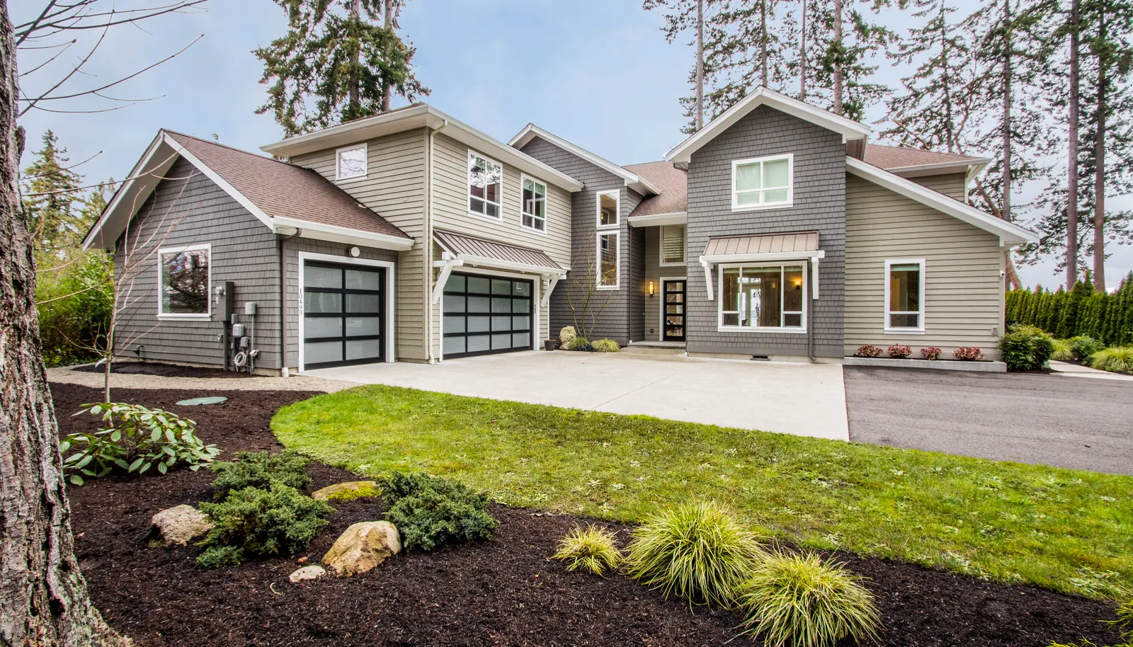 Down a private lane, sitting high on a bank looking over the Puget Sound sits your home in waiting.