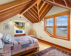 The upper west bedroom has a warm built in window seat 