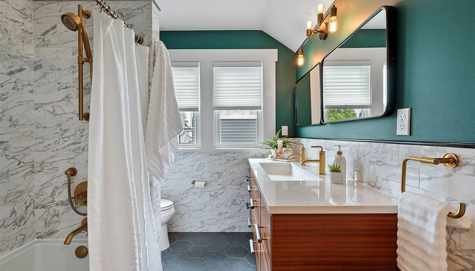 Tastefully renovated bath on upper level.