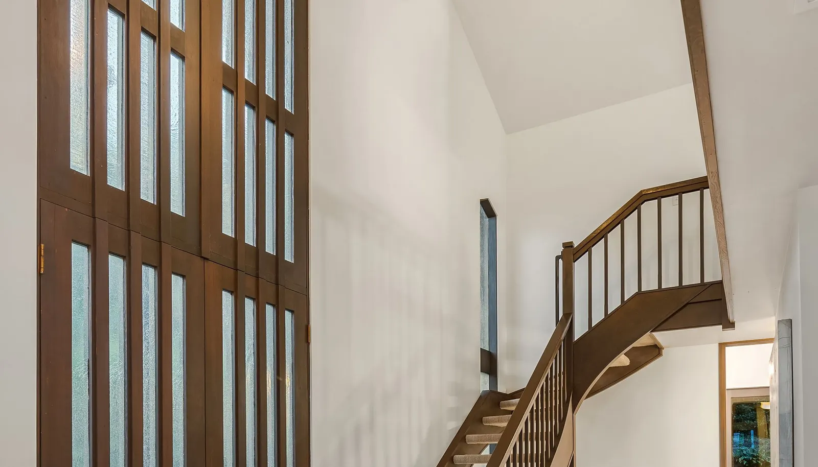 The cathedral ceilings throughout and the two-story entry hall provide a spacious feel and unique ambiance.