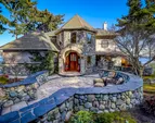 Exquisite real river rock and natural stone walls, patios, pathways, and siding.