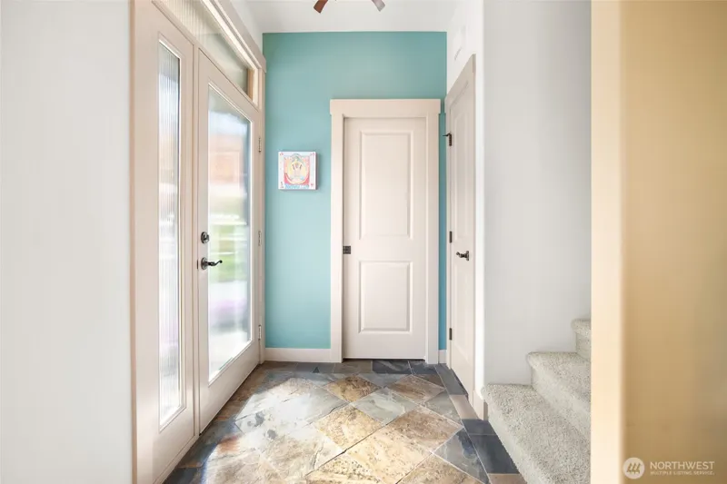 Welcoming entry with natural light and a direct connection into the home.
