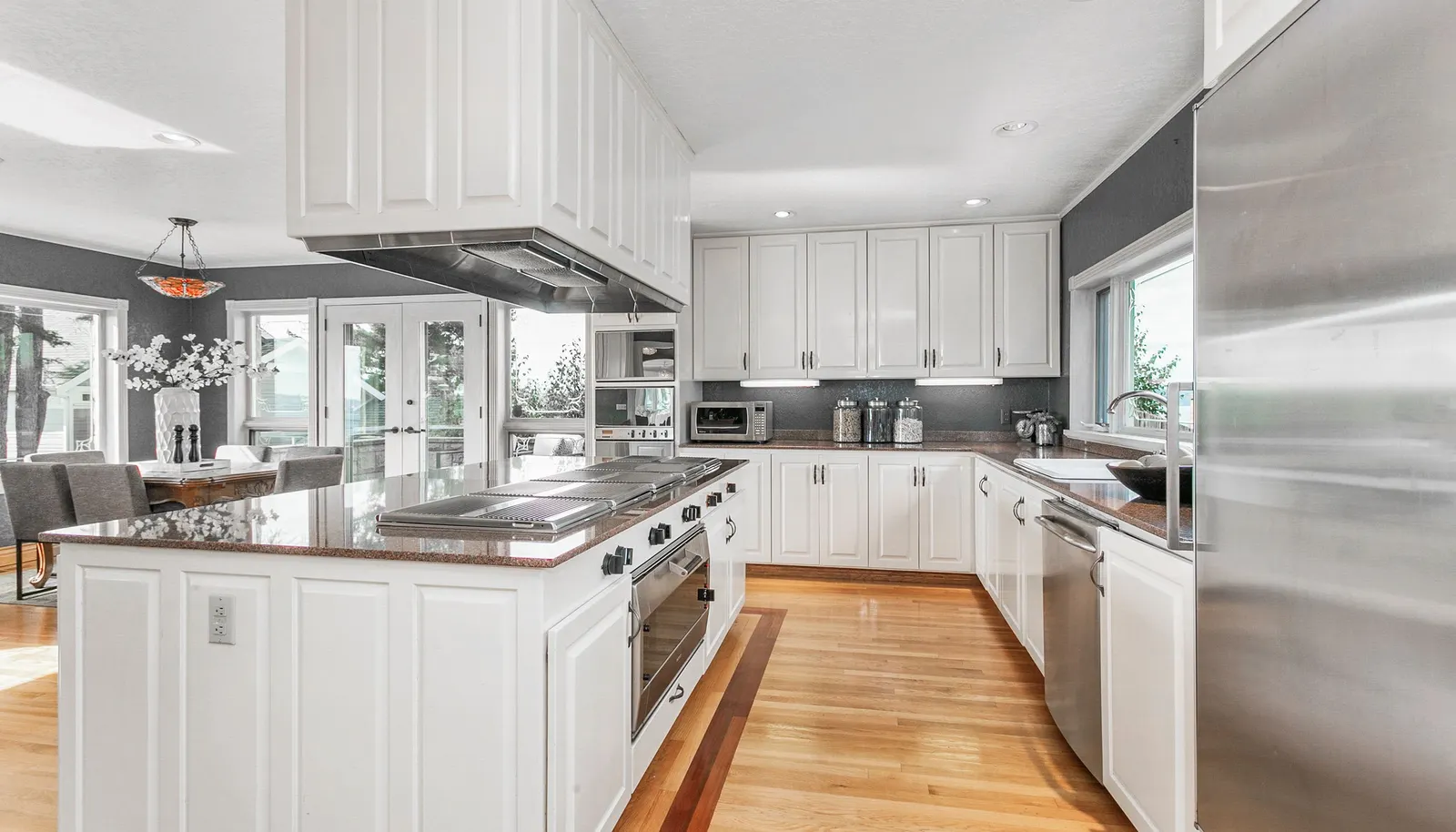 Spacious chef's kitchen was designed for entertaining. Full size Sub Zero refrigerator and matching full size Sub Zero freezer, lots of counter space, two sinks, large pantry and storage galore. Spacious chef's kitchen was designed for entertaining. Full size Sub Zero refrigerator and matching full size Sub Zero freezer, lots of counter space, two sinks, large pantry and storage galore.