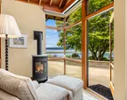 How cozy is this? The sitting area in the primary suite has a gas stove. The perfect place to curl up with a book.