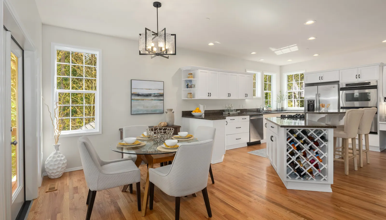 Kitchen area with new hardwood floors.