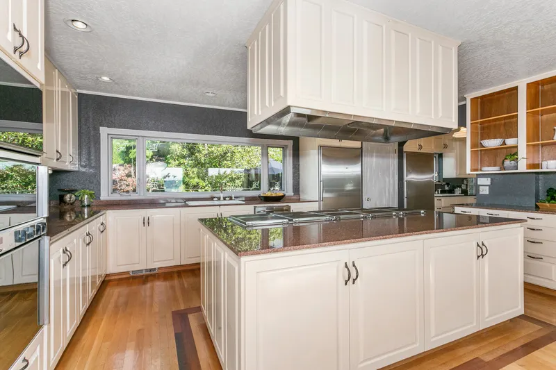 Kitchen features 5 cooktop Gaggenau stove, Gaggenau double ovens, separate Sub Zero refrigerator and Sub Zero freezer, storage galore. Kitchen features 5 cooktop Gaggenau stove, Gaggenau double ovens, separate Sub Zero refrigerator and Sub Zero freezer, storage galore.