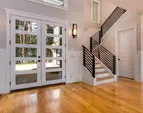 Gleaming oak wide plank wood floors throughout the entire home in all but the three carpeted upstairs rooms.