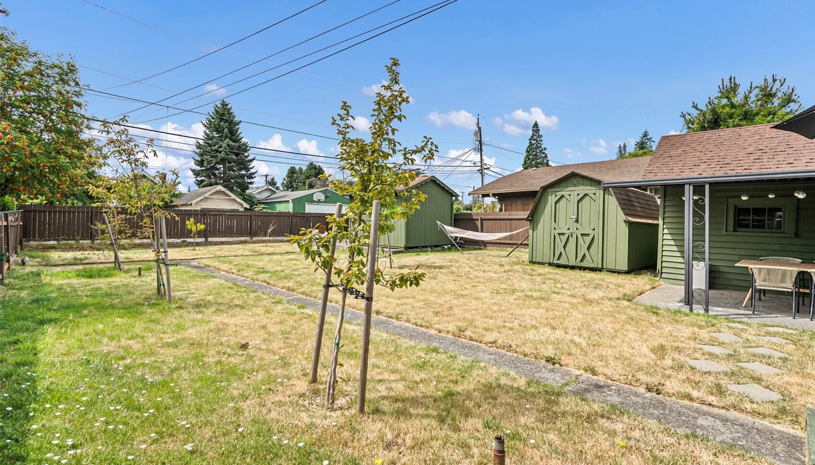 In addition to a 1-car garge, there are two storage sheds