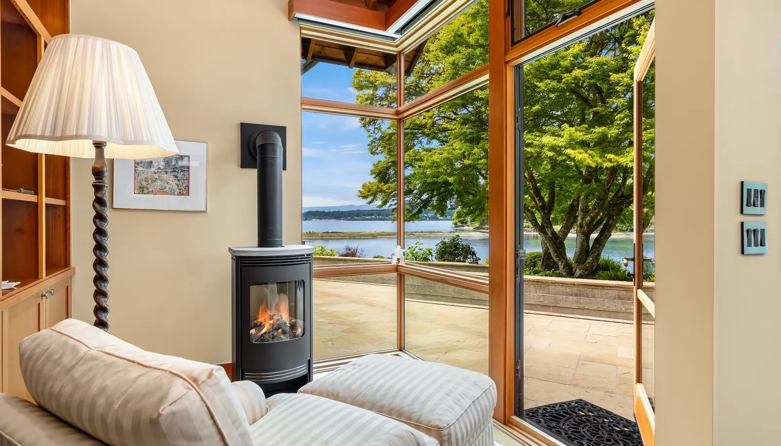 How cozy is this? The sitting area in the primary suite has a gas stove. The perfect place to curl up with a book.