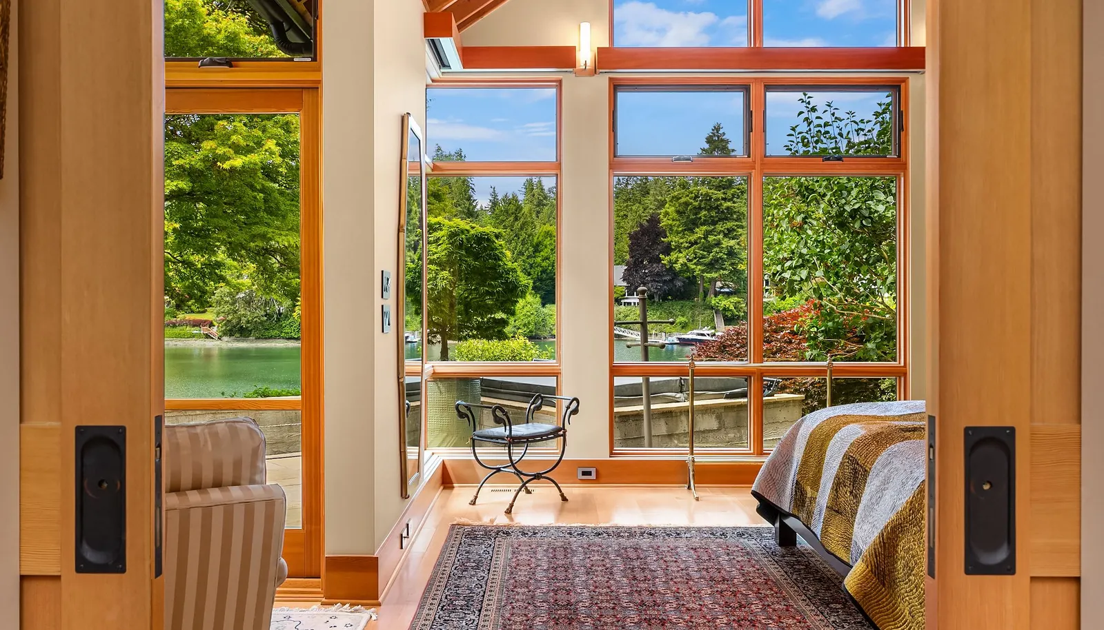 The primary suite is tucked away for privacy while still being integrated with the outdoor spaces. 