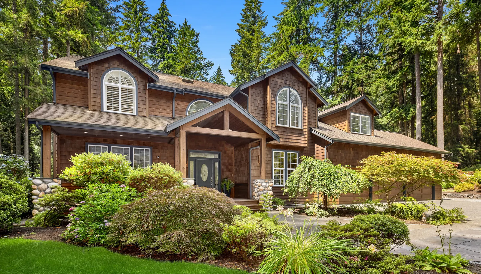 Just steps to the Grand Forest and Battle Point Park! Four bedrooms including the Primary Suite; a Recreation Room with a bar; a bonus room and a den/office.