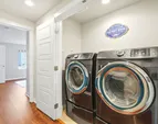 Hidden in a closet are the full-size high-end washer and dryer.