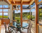 The waterside breakfast nook opens to the covered patio space