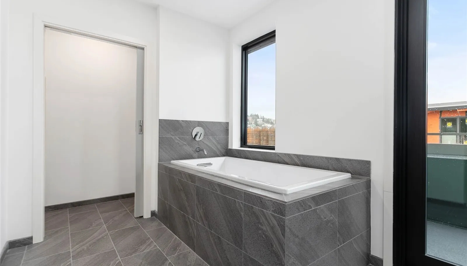 Showroom full bath. Finishes vary by unit. Furniture not included in sale.