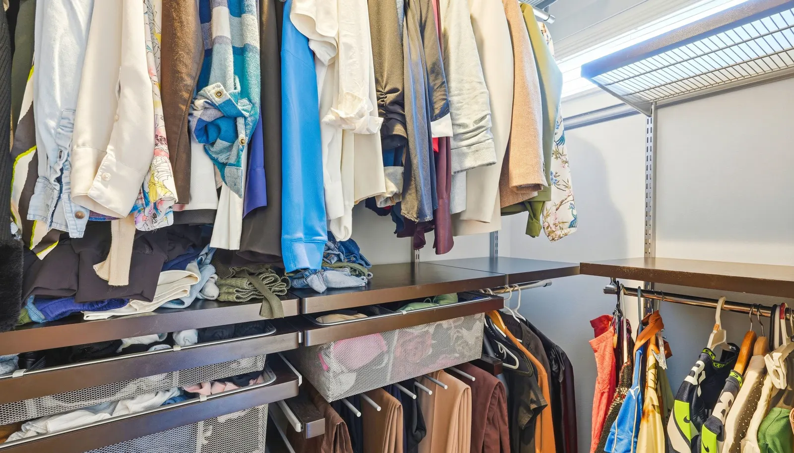 Custom Elfa closet system in the primary suite thoughtfully designed for organization and efficiency.