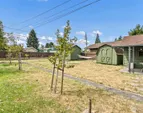 In addition to a 1-car garge, there are two storage sheds