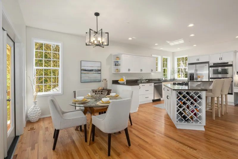Kitchen area with new hardwood floors.