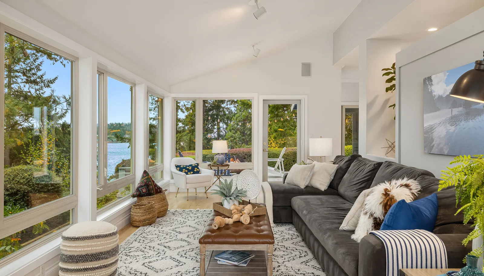 The living room has a beautiful view of Rich Passage and overlooks the gardens. Vaulted ceilings, maple floors and a French door to the deck outside.