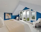 On the upper level enjoy a relaxing private primary retreat