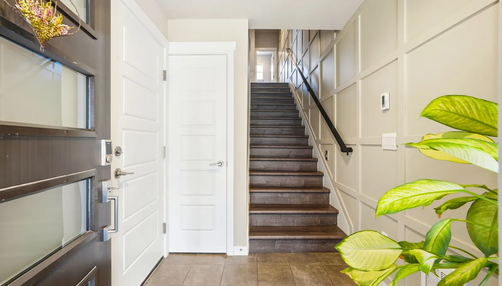 The inviting entry is enhanced with elegant board-and-batten detailing for a refined welcome.