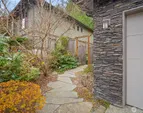 Pathway to private backyard garden retreat.